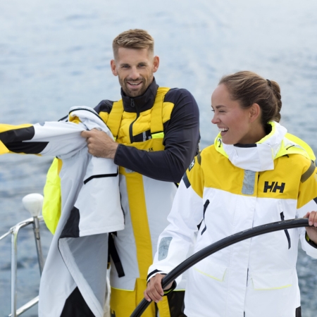 Men and women with overalls and Helly Hansen shift jacket