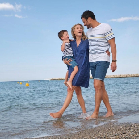 family in sailor top at the beach